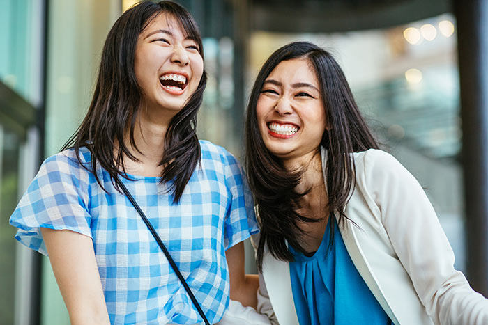 Two Laughing Women